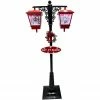 Fraser Hill Farm Let It Snow Series 74-In. Dual-Lantern Street Lamp W/ Snowman, Tree, 1 Sign, Cascading Snow And Christmas Carols, Red/Black